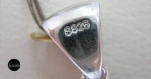 Sterling silver jewelry collection on a soft cloth surface