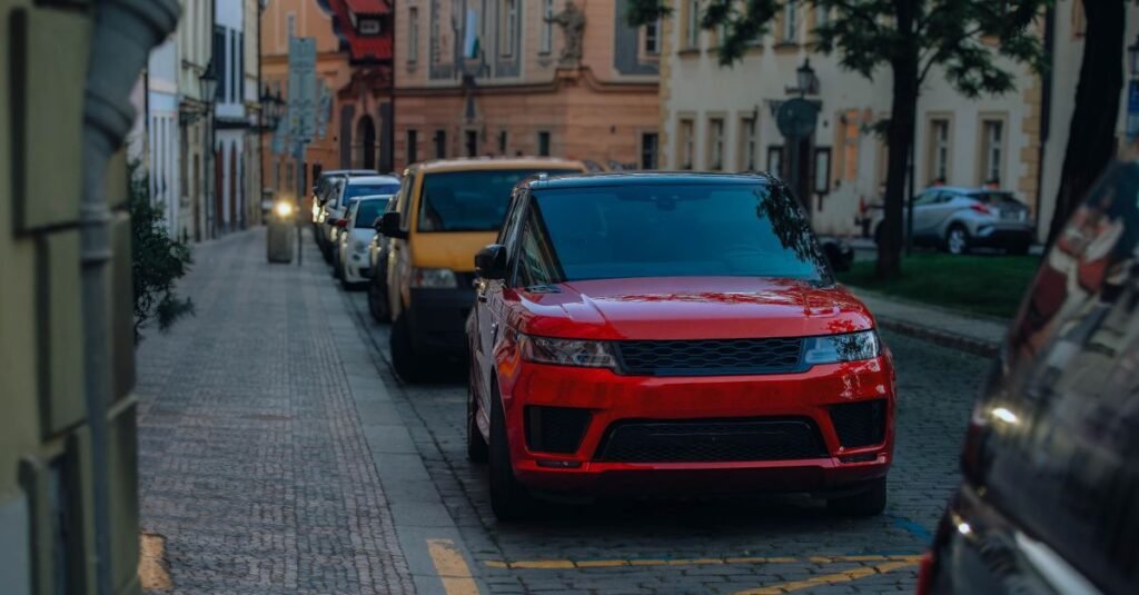 Car parked on a quiet city street at dusk