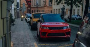 Car parked on a quiet city street at dusk