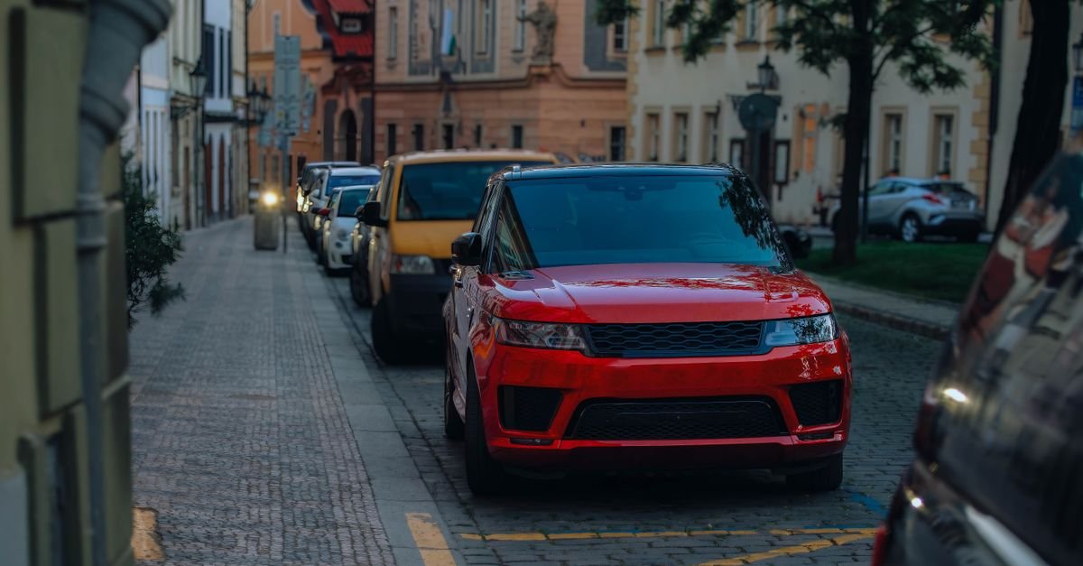 Car parked on a quiet city street at dusk