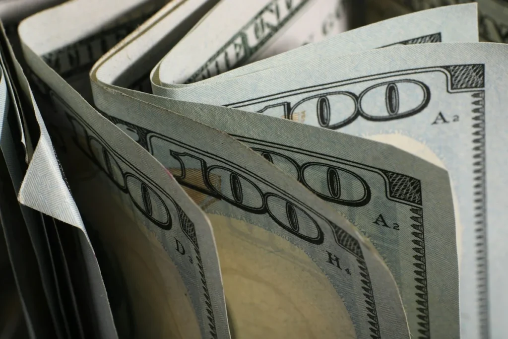 Fanned $100 bills ready for envelope budgeting