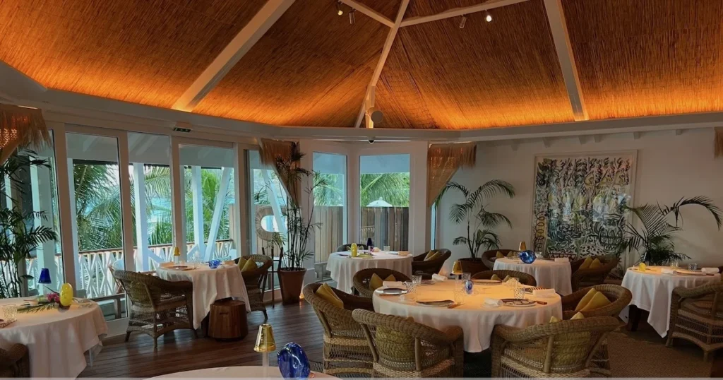 Upscale restaurant dining room with white tablecloths