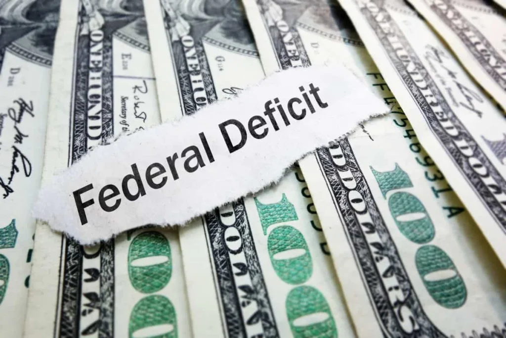 US dollar bills stacked with federal deficit theme