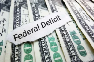 US dollar bills stacked with federal deficit theme